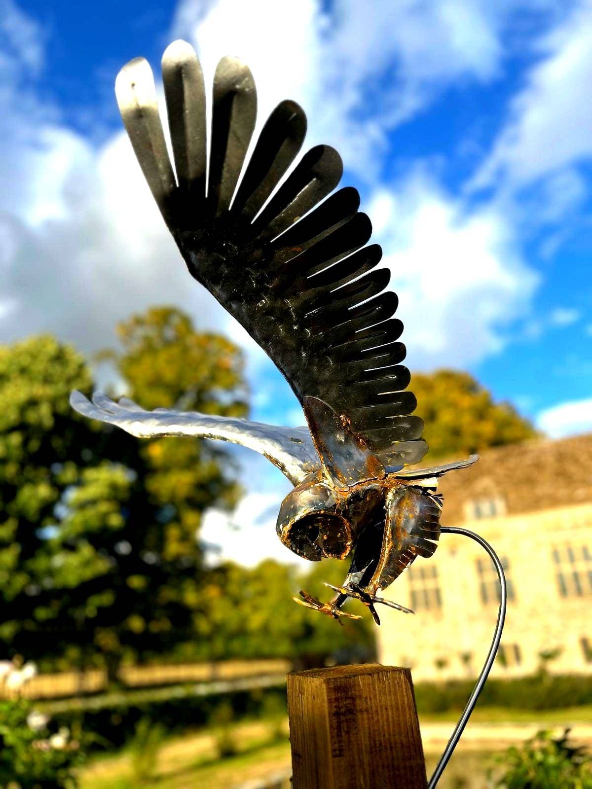 Barn owl in landing position — metal sculpture